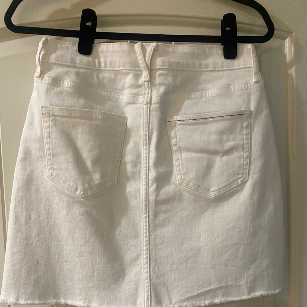 New White Cap white denim shirt with frayed hem. Adorable.